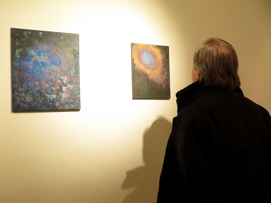 My dad looking at my work.